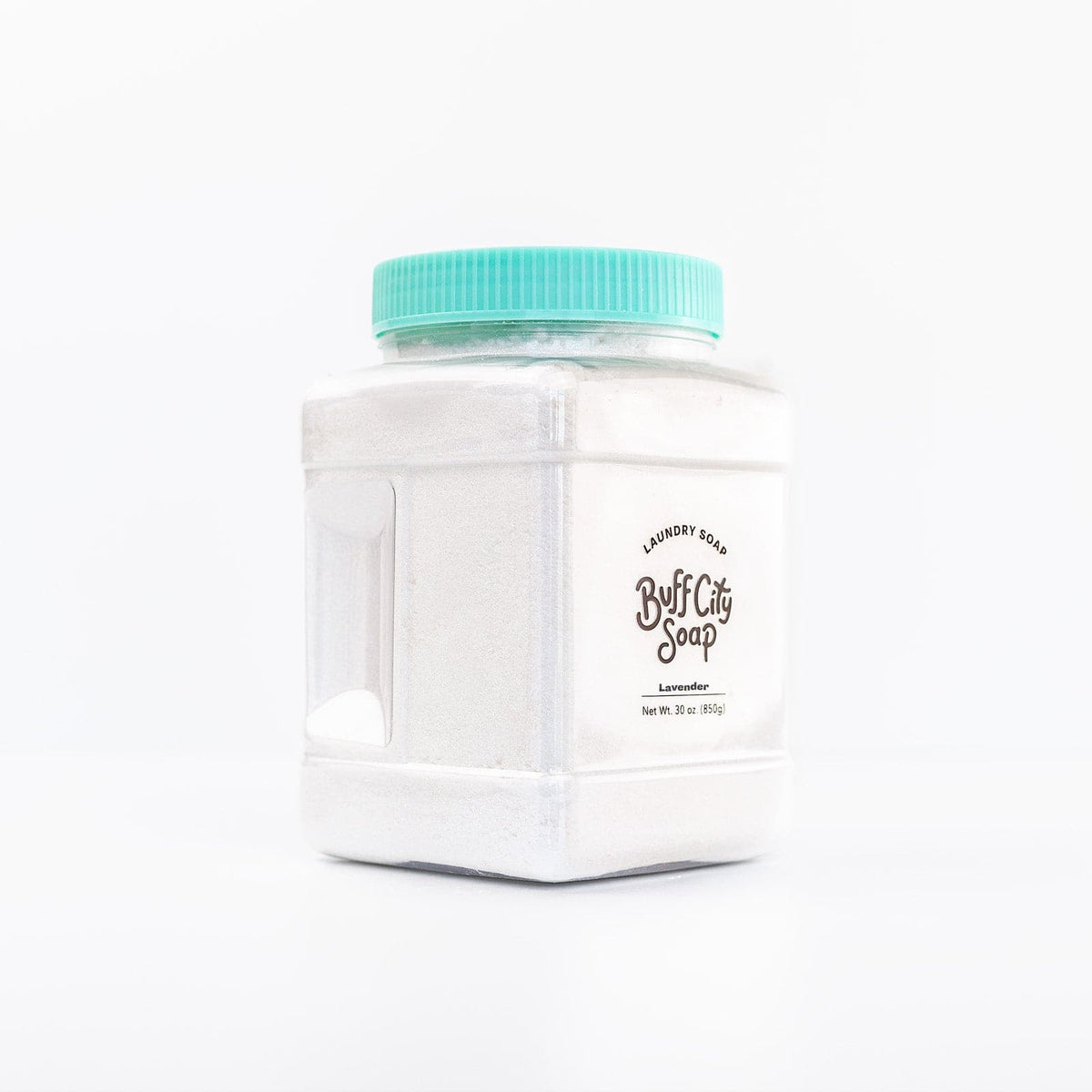 Clear plastic container of Buff City Soap's lavender scented laundry soap with a teal lid