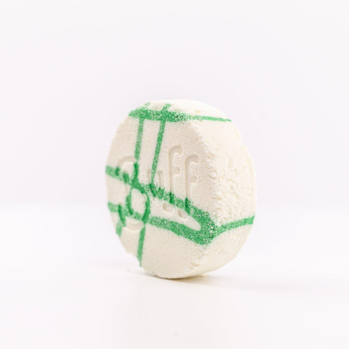 Buff City Soap's lemongrass + eucalyptus scented shower fizzy soap with buff written on its side