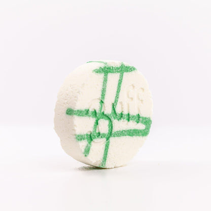 Buff City Soap's lemongrass + eucalyptus scented shower fizzy soap with buff written on its side