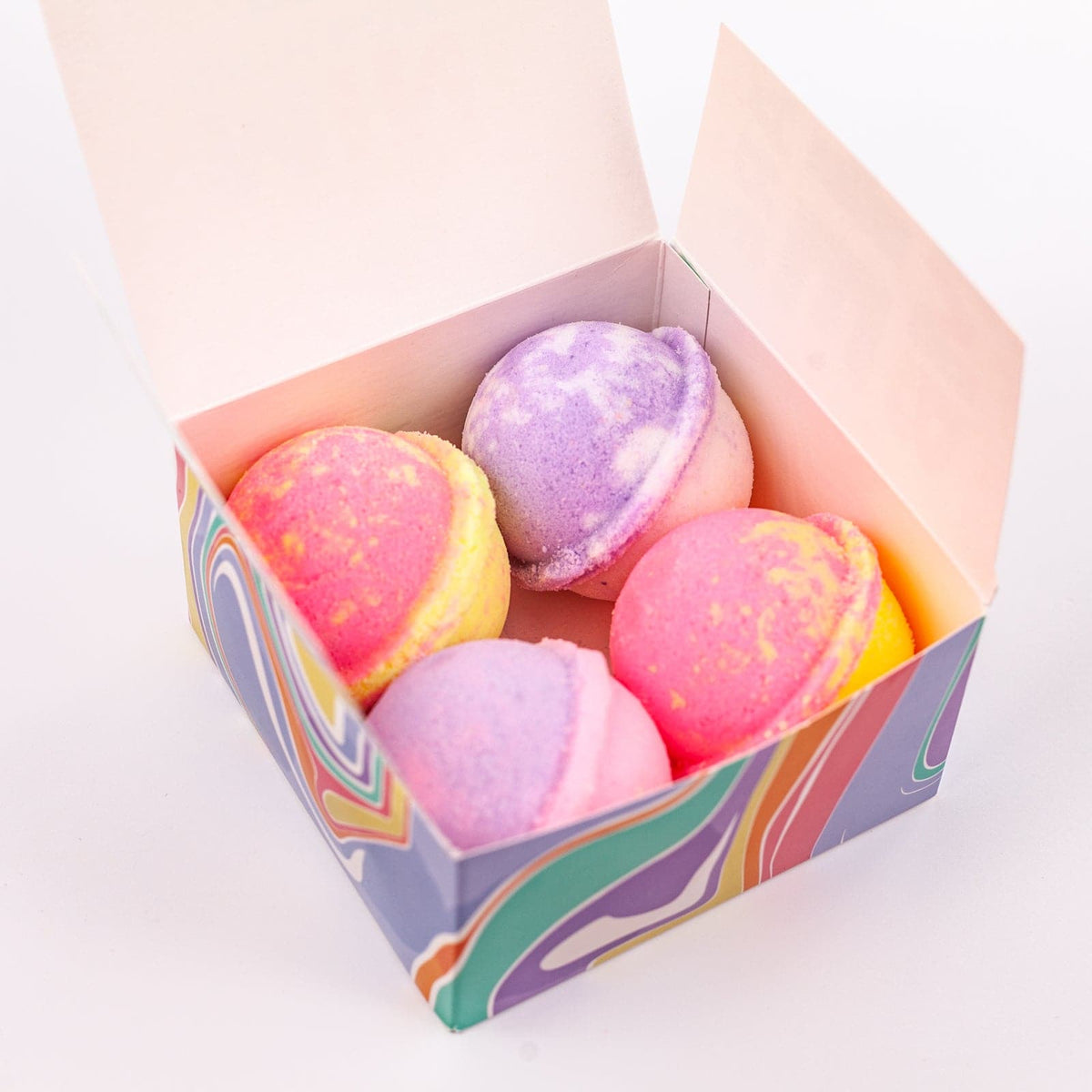 top view of 4 multi colored Mini Bath Bombs