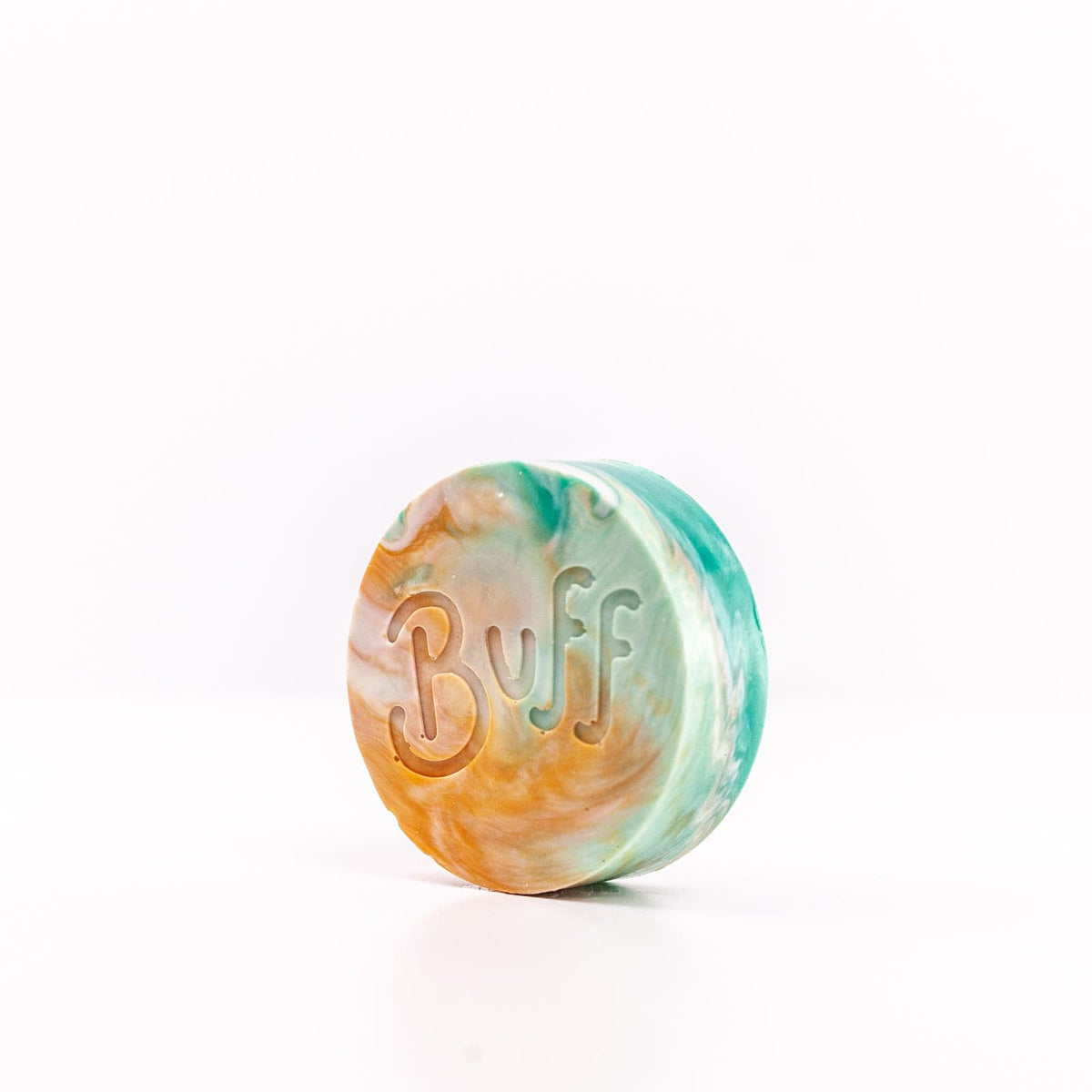 angled left view of teal, white, and orange Narcissist Shave Bar with "Buff" engraved in bar