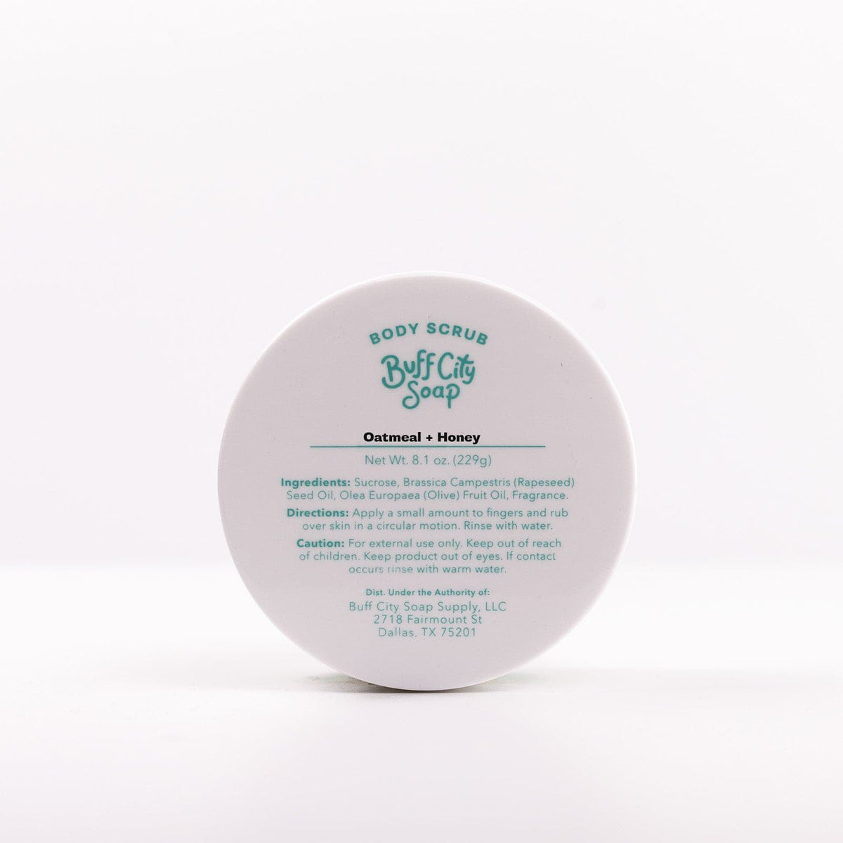 front view of Oatmeal + Honey Body Scrub lid with list of ingredients